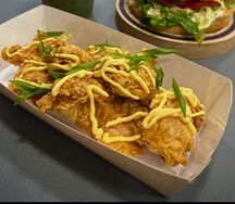 Байтсы под сырным соусом 