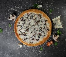 Пицца с ветчиной и грибами