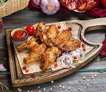 Куриные крылышки на углях