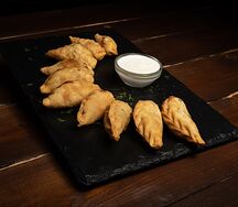 Вареники жареные