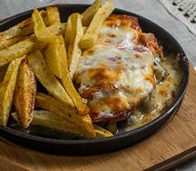 Отбивная по-купечески из свинины с картошкой