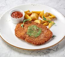 Шницель по-милански с зеленым маслом