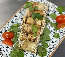 Рулеты из баклажана с помидором и ореховым соусом