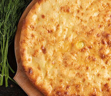 Пирог по-осетински с сыром и зеленью