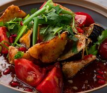 Теплый салат из баклажанов с томатами