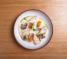 Ризотто с патагонскими кальмарами и соусом ромеско