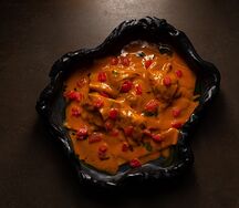 Равиоли с форелью под соусом том ям