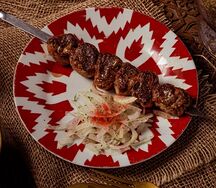 Шашлык из телячьей печени, обернутый в чарви