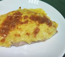 Куриная отбивная запеченная под сыром