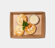 Сырники с цедрой апельсина и муссом на основе белого шоколада