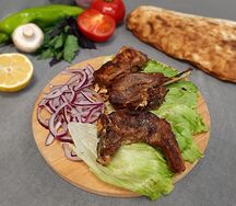 Бараньи рёбра на мангале