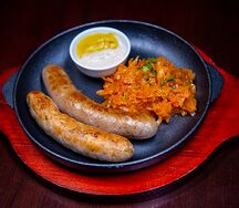 Колбаски Баварские с тушеной капустой