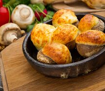 Шапочки шампиньонов запеченные с сыром