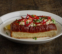 Сrab brioche, соус из соленых лимонов, романо, томат