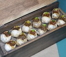 Улити с томатным соусом и специями