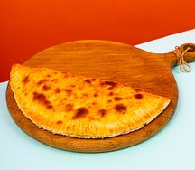 Кальцоне с ветчиной и грибами