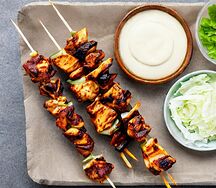 Chicken kebabs served with salads