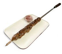 Шашлык из говяжьей печени в жировой сетке