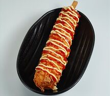 Корн-дог с сосиской в хлопьях