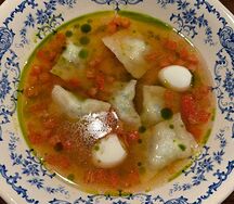 Куриный бульон с равиоли и конкассе
