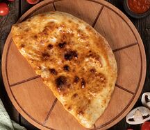 Пицца Кальцоне мясная
