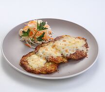 Драники, запеченные под сыром