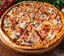 Пицца с ветчиной и грибами